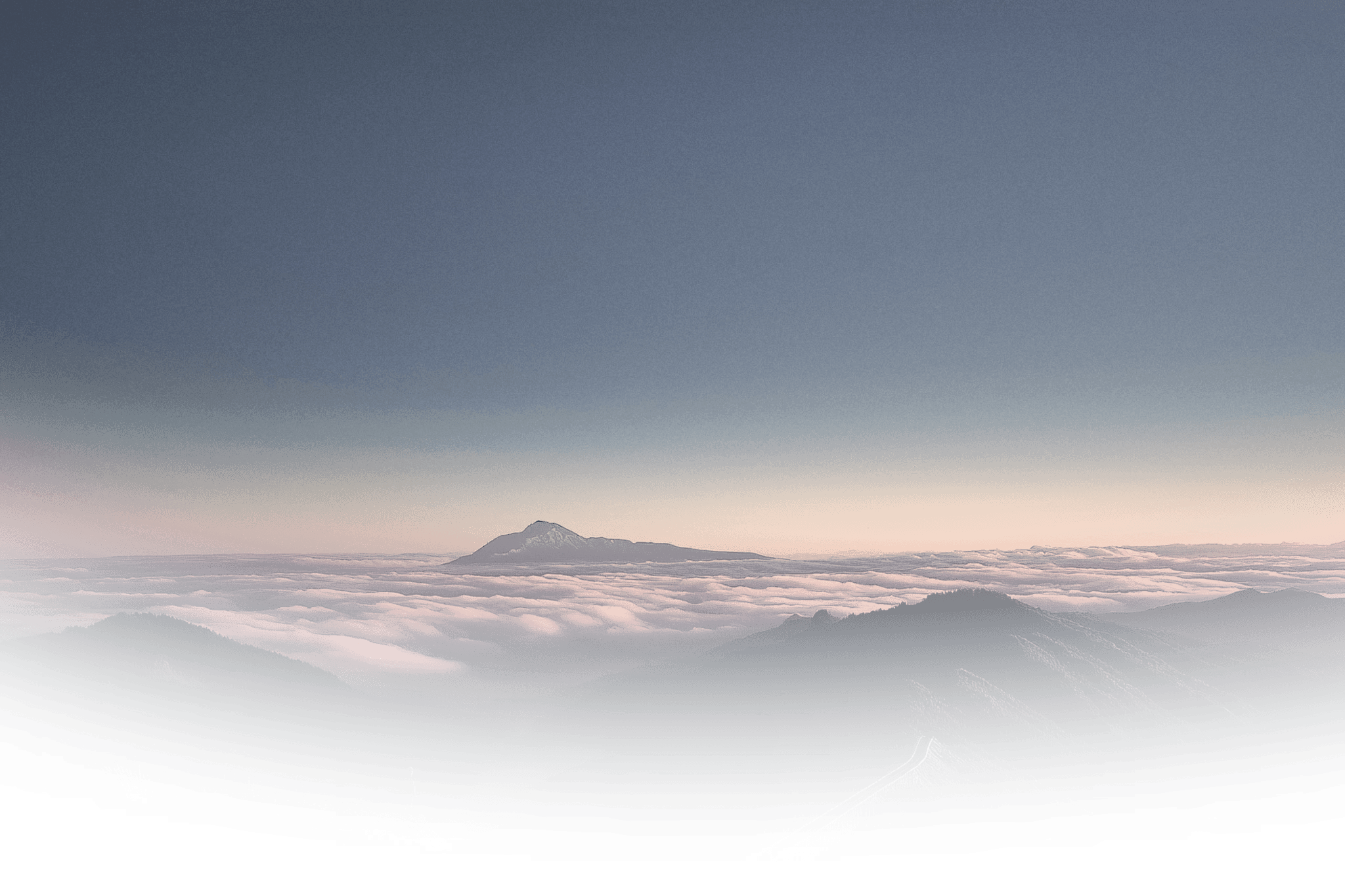 Mountain peaks above a sea of clouds